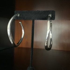 Silver hoops with a twist